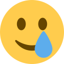 smiling face with tear